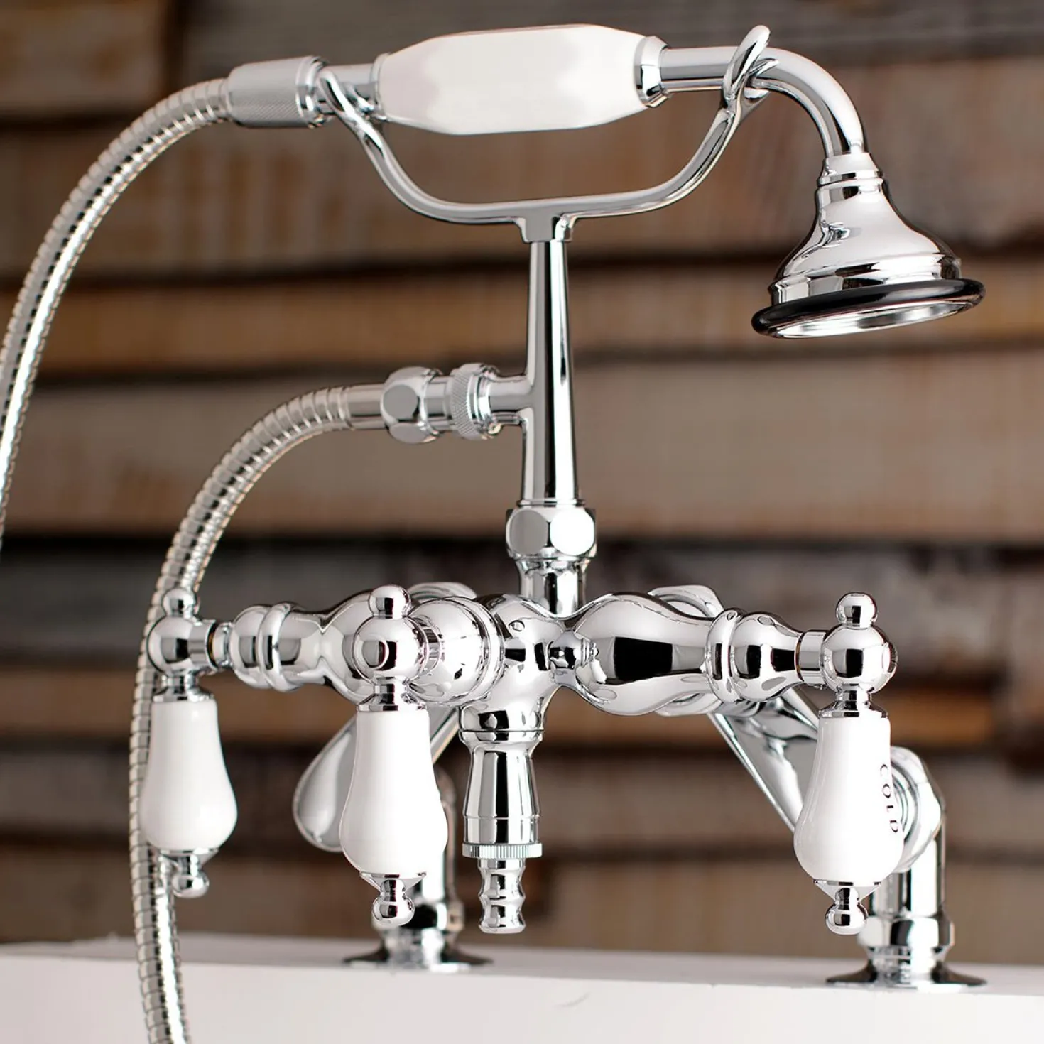 Kingston Brass Aqua Vintage 3-3/8" Adjustable Deck Mount Tub Faucet with Hand Shower in Polished Chrome