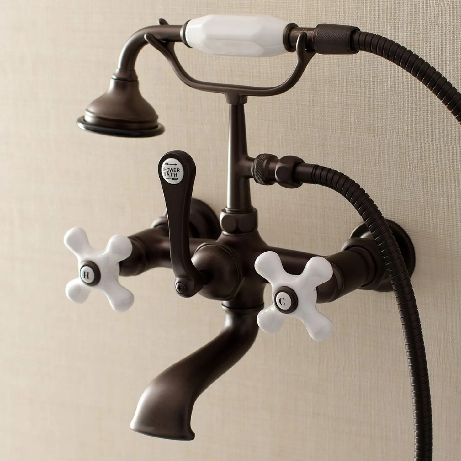Kingston Brass Aqua Vintage 7-Inch Wall Mount Tub Faucet with Hand Shower