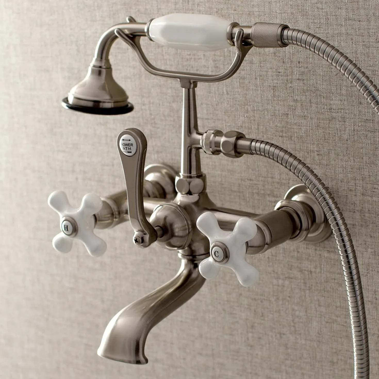 Kingston Brass Aqua Vintage 7-Inch Wall Mount Tub Faucet with Hand Shower