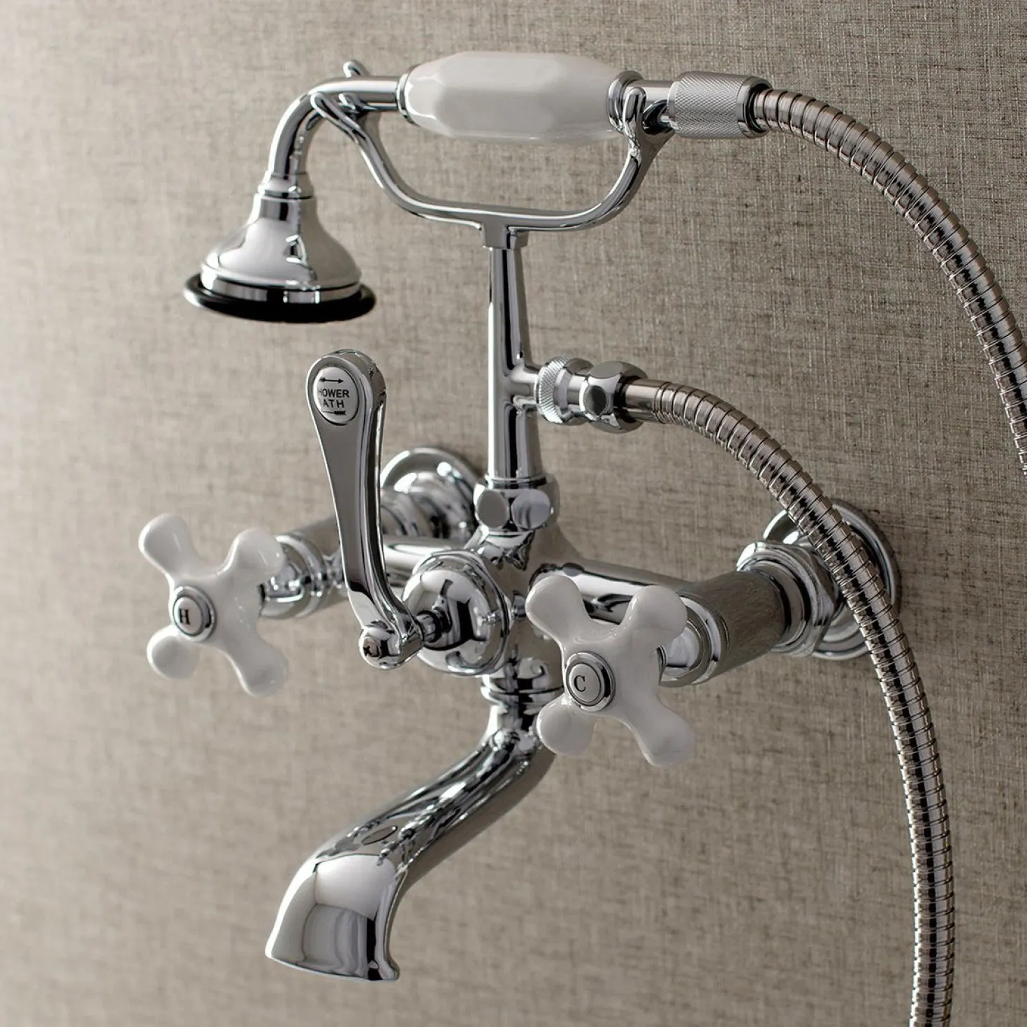 Kingston Brass Aqua Vintage 7-Inch Wall Mount Tub Faucet with Hand Shower