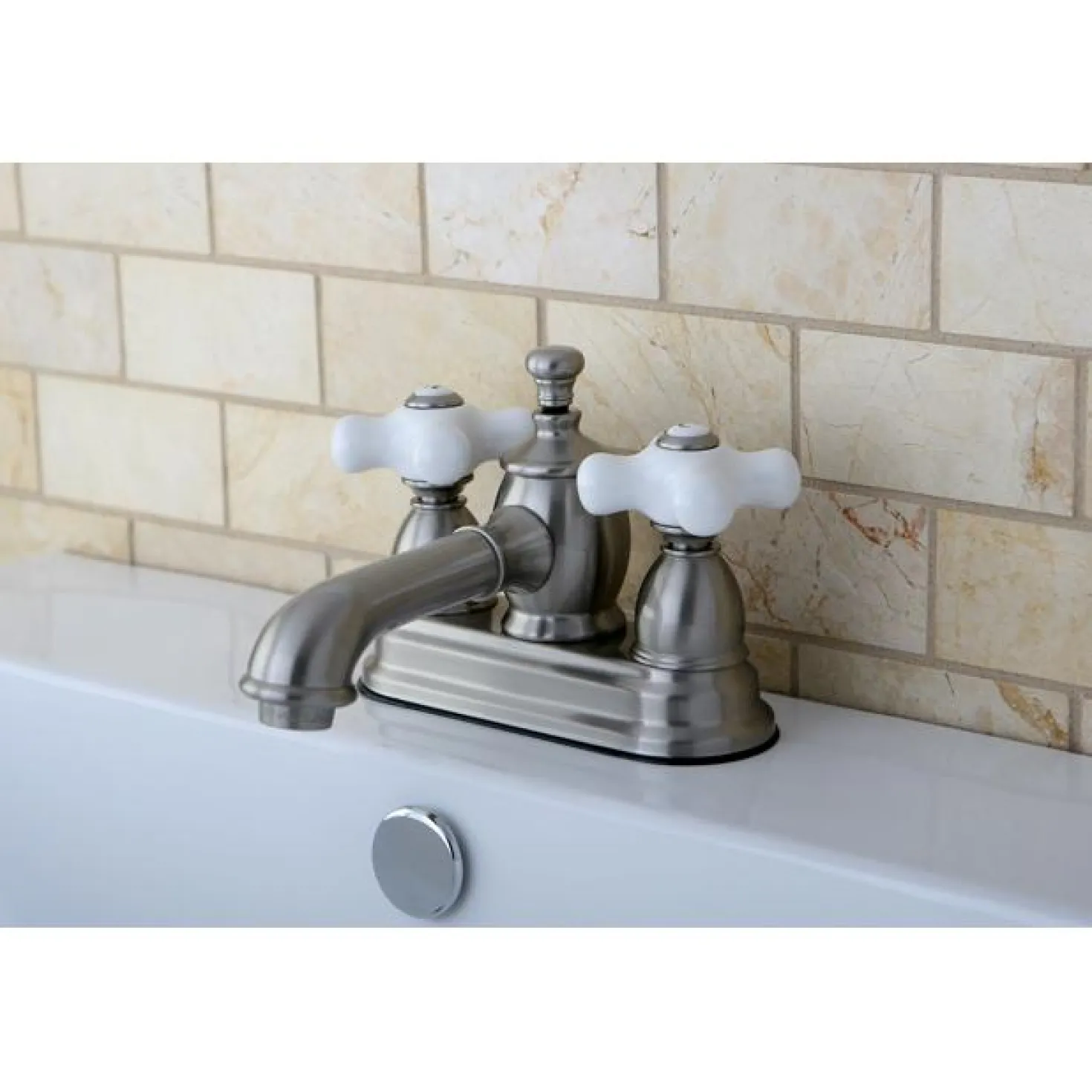 Kingston Brass 4" Centerset Lavatory Faucet with Heritage Spout and Porcelain Cross Handle