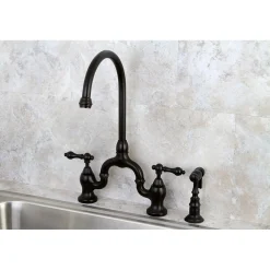 Kingston Brass English Country Deck Mount Kitchen Bridge Faucet with Brass Sprayer