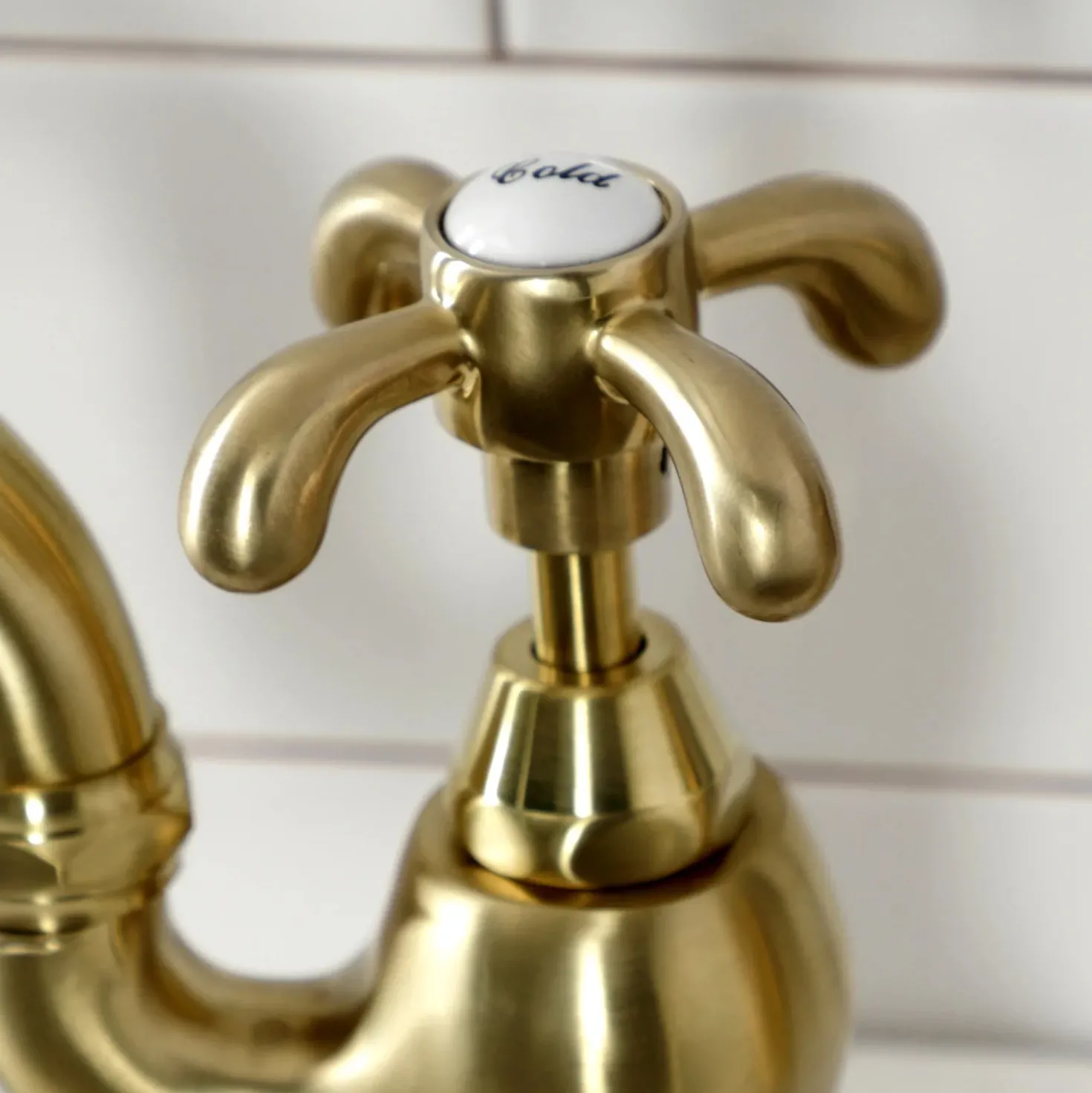 Kingston Brass Heirloom French Country Two-Handle 3-Hole Deck Mount Bridge Kitchen Faucet with Brass Sprayer