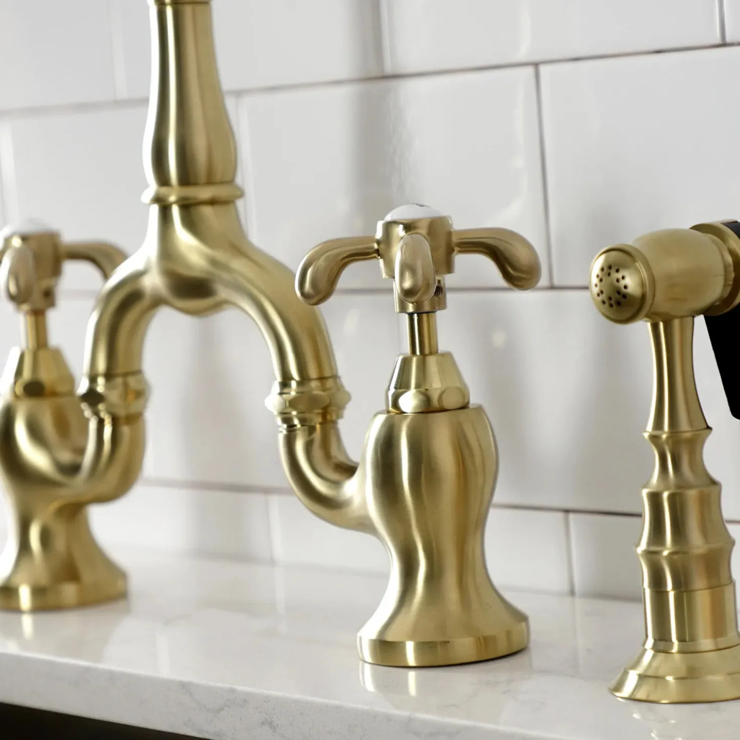 Kingston Brass Heirloom French Country Two-Handle 3-Hole Deck Mount Bridge Kitchen Faucet with Brass Sprayer