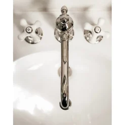 Kingston Brass Heritage Deck Mount 3-Hole 8-Inch Widespread Bathroom Faucet