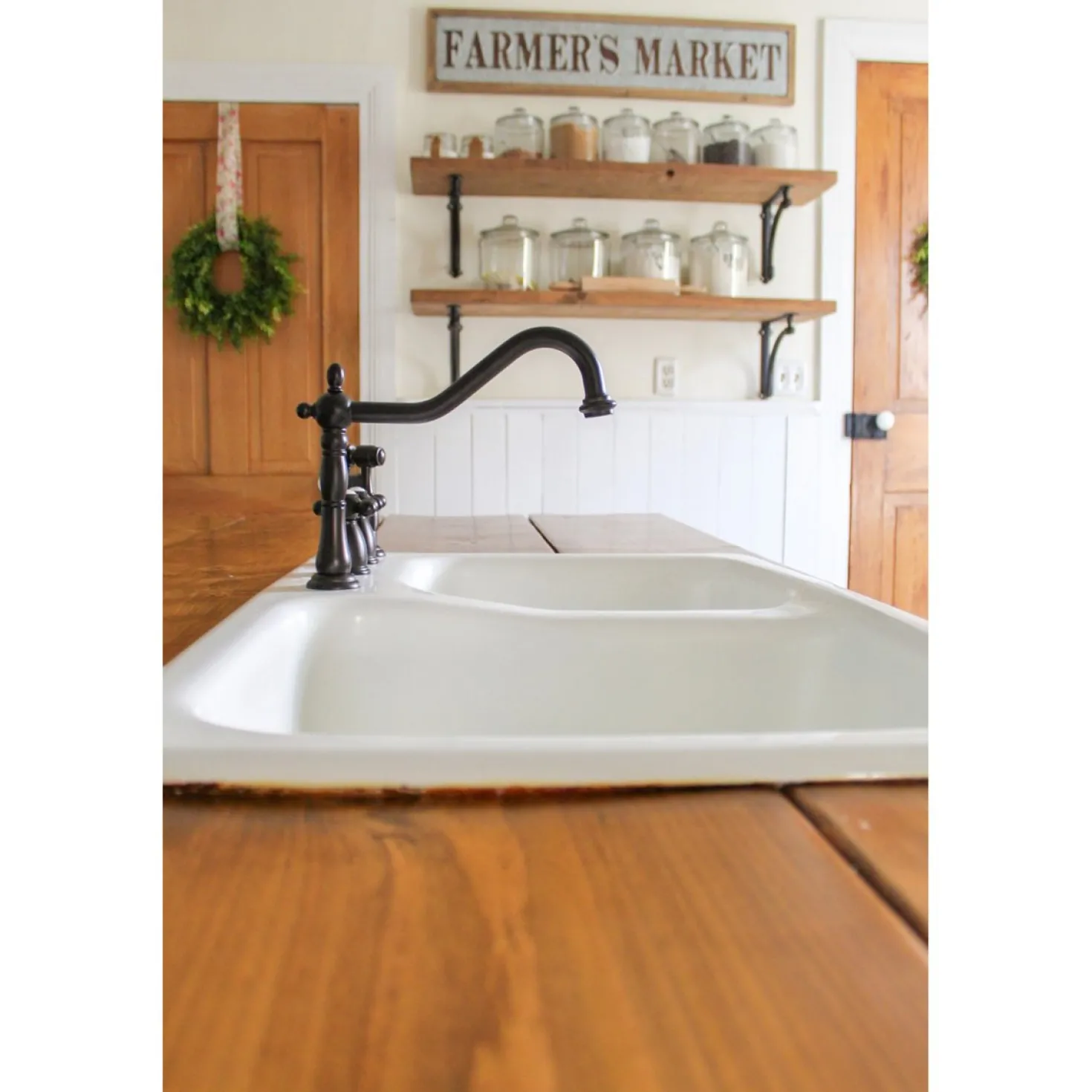 Kingston Brass Heritage Widespread Kitchen Faucet with Brass Sprayer