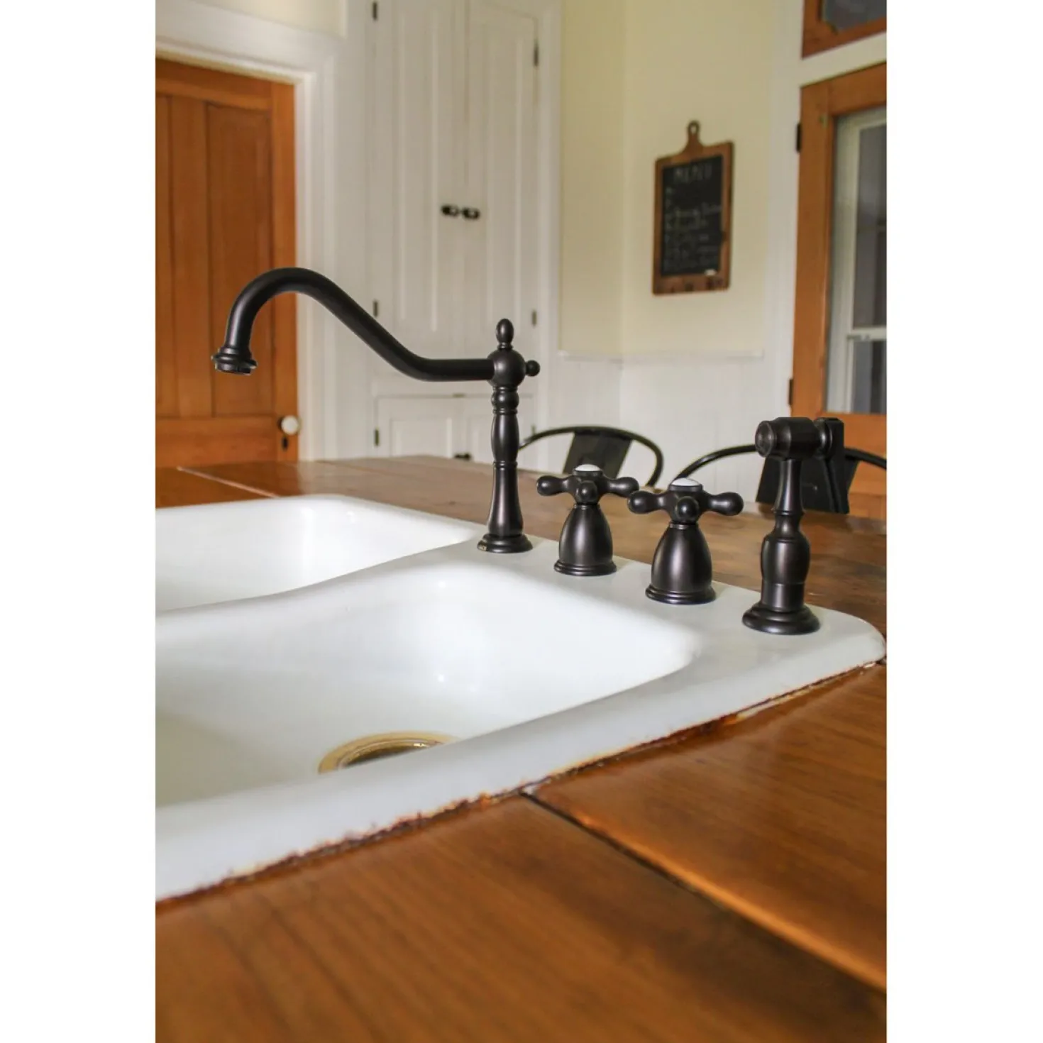Kingston Brass Heritage Widespread Kitchen Faucet with Brass Sprayer