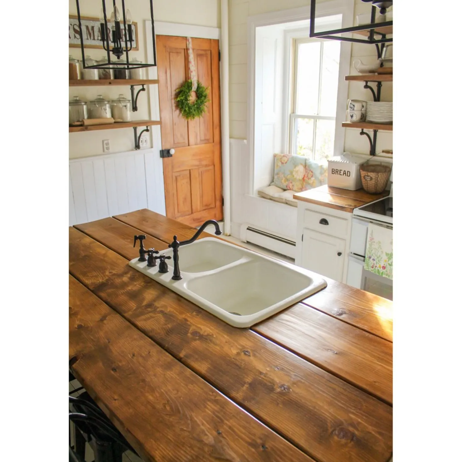 Kingston Brass Heritage Widespread Kitchen Faucet with Brass Sprayer