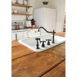 Kingston Brass Heritage Widespread Kitchen Faucet with Brass Sprayer