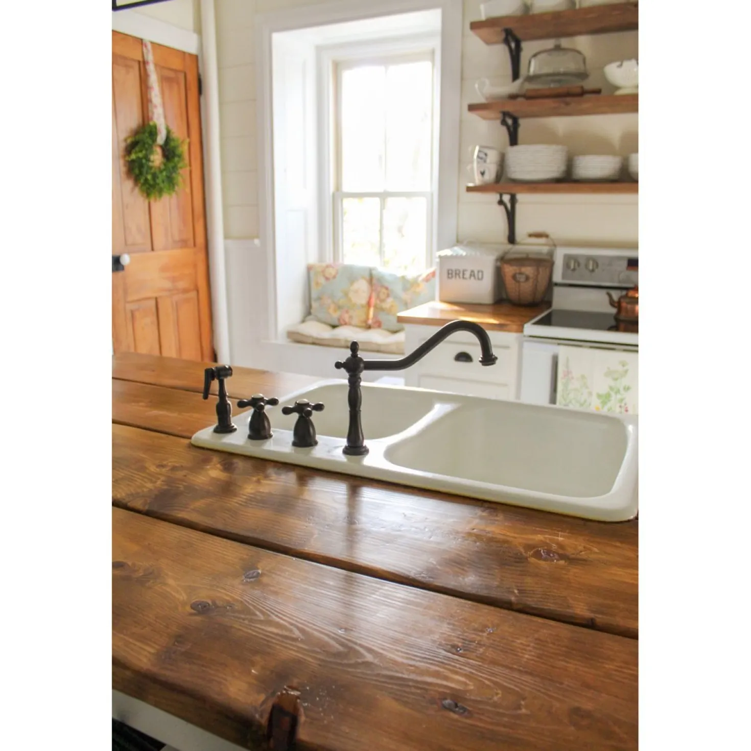 Kingston Brass Heritage Widespread Kitchen Faucet with Brass Sprayer
