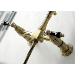 Kingston Brass KS126XPKLBS-P Duchess Wall Mount Bridge Kitchen Faucet with Brass Sprayer