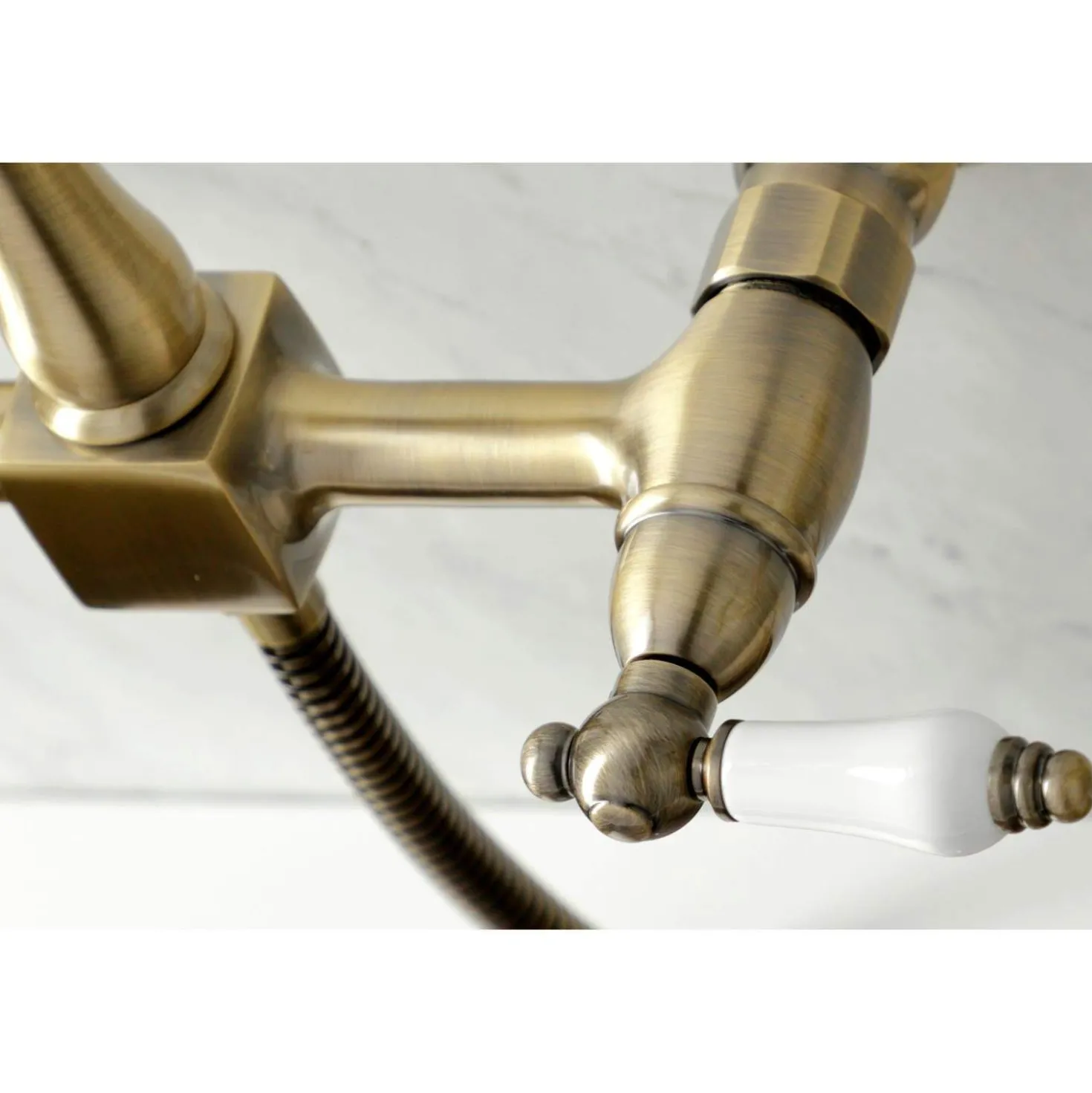 Kingston Brass KS124XPLBS-P Heritage Two-Handle Wall Mount Bridge Kitchen Faucet with Brass Sprayer