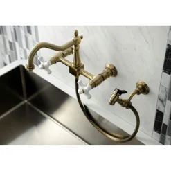 Kingston Brass KS124XPXBS-P Heritage Two-Handle Wall Mount Bridge Kitchen Faucet with Brass Sprayer