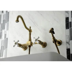 Kingston Brass KS124XPXBS-P Heritage Two-Handle Wall Mount Bridge Kitchen Faucet with Brass Sprayer