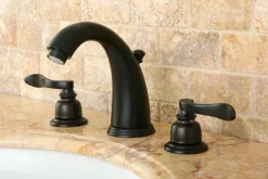 Kingston Brass NuWave French Widespread Lavatory Faucet with ABS/Brass Pop-up