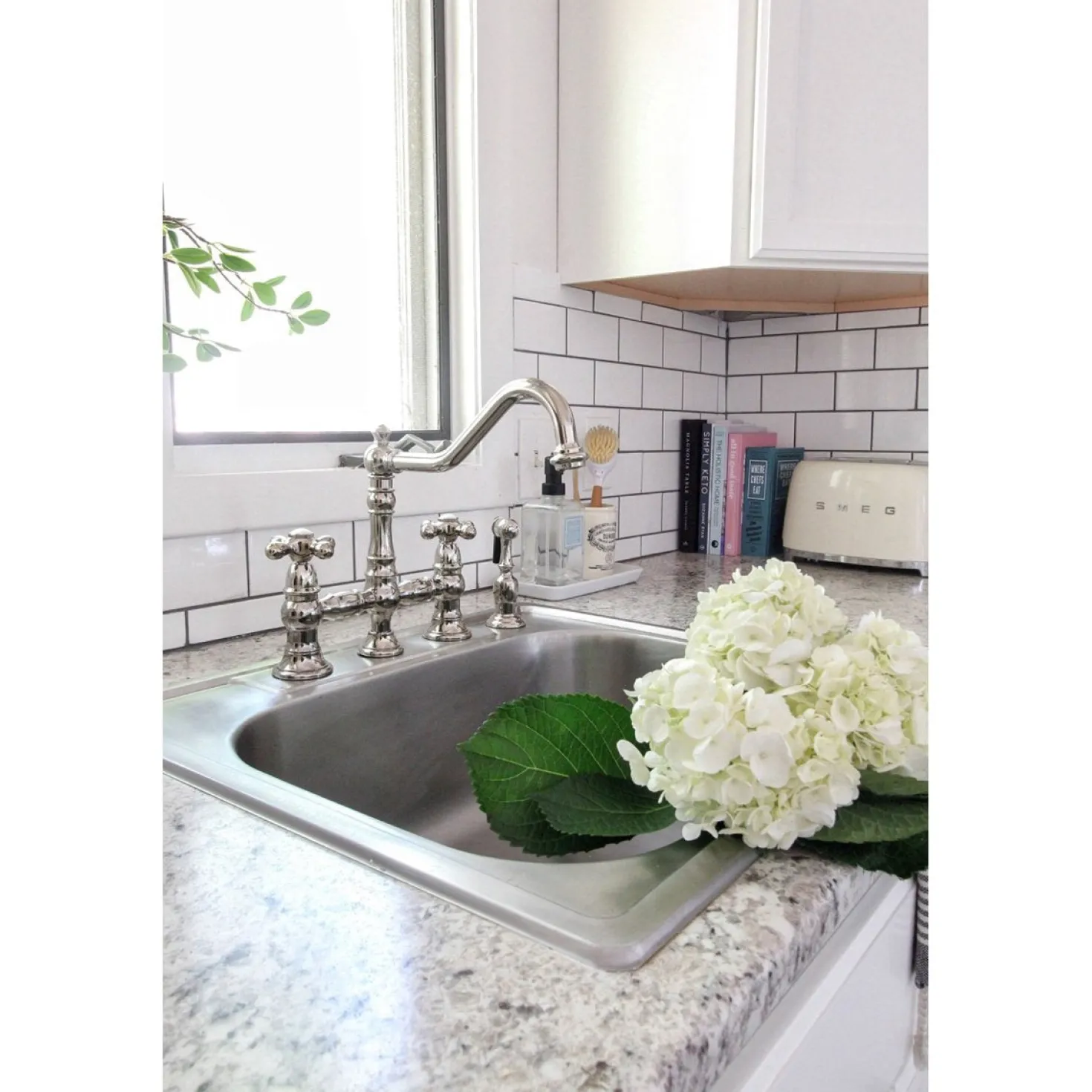 Kingston Brass Restoration 8" Bridge Kitchen Faucet with Sprayer