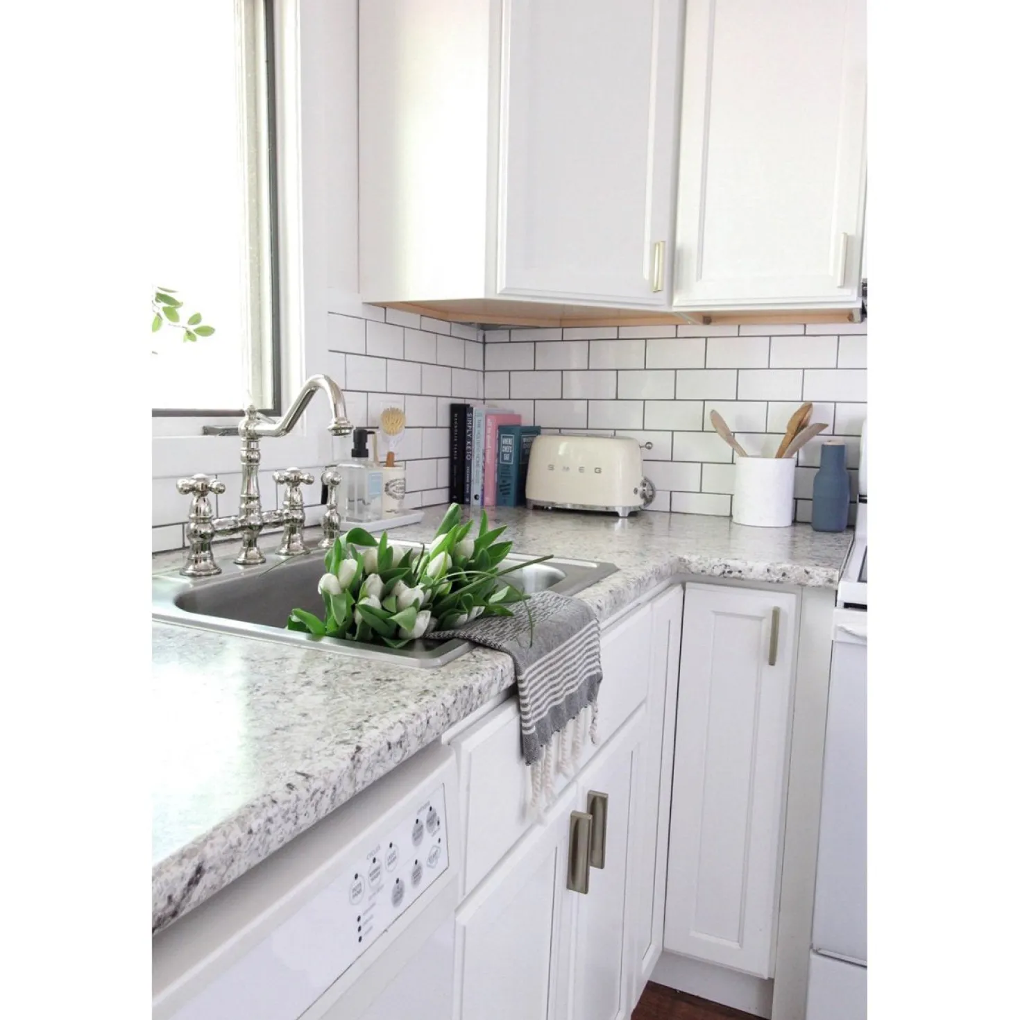 Kingston Brass Restoration 8" Bridge Kitchen Faucet with Sprayer