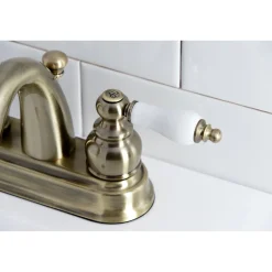 Kingston Brass Restoration Deck Mount 4-Inch Centerset Bathroom Faucet