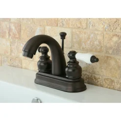 Kingston Brass Restoration Deck Mount 4-Inch Centerset Bathroom Faucet