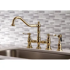 Kingston Brass Restoration 8-Inch Bridge Kitchen Faucet with Sprayer