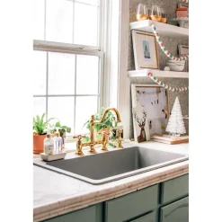 Kingston Brass Restoration Kitchen Bridge Faucet with Brass Sprayer