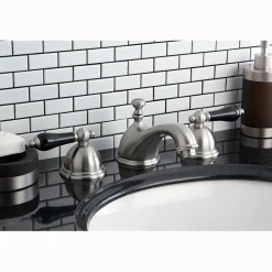 Kingston Brass Restoration Onyx Widespread Lavatory Faucet with Black Porcelain Lever Handle