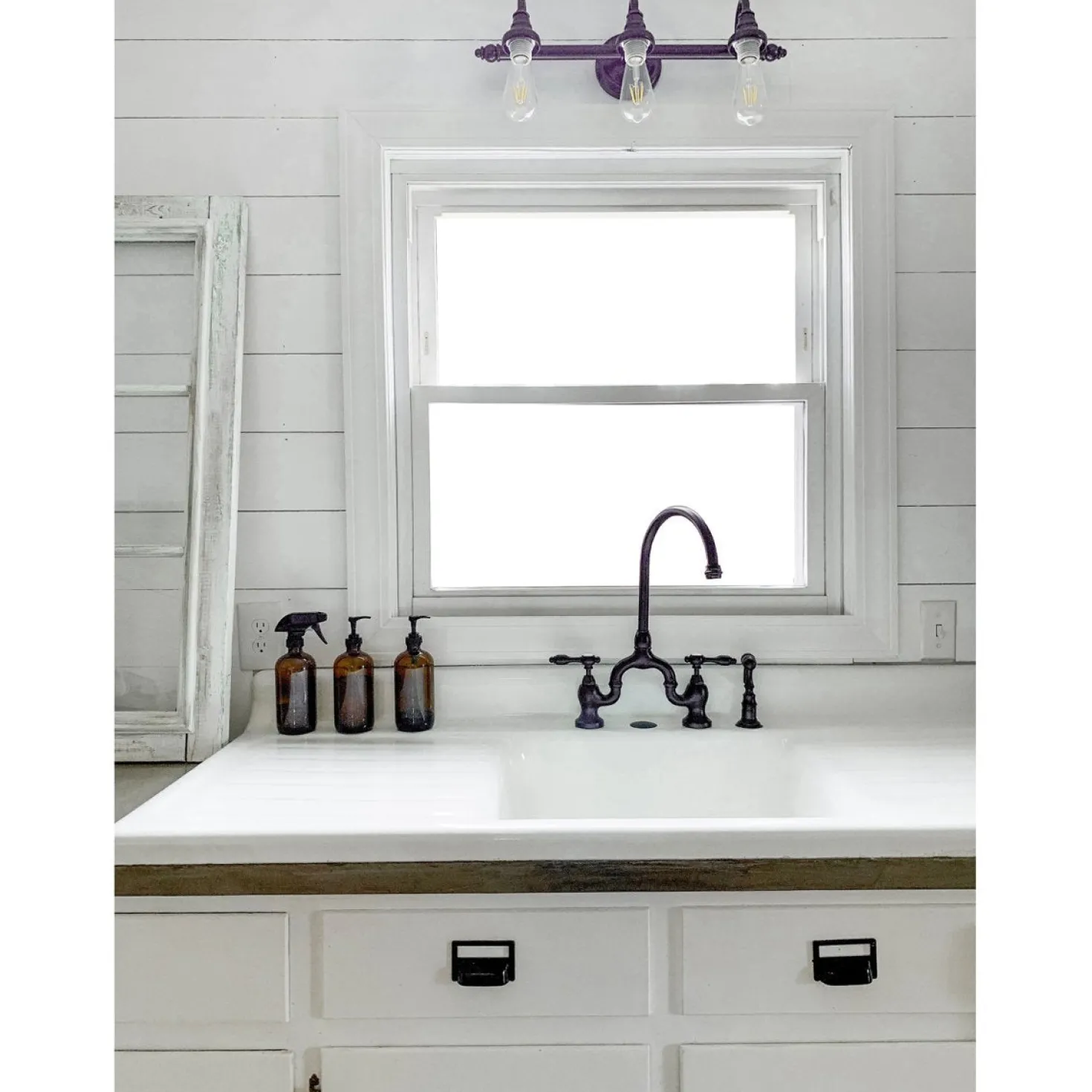 Kingston Brass Tudor Bridge Deck Mount Kitchen Faucet with Brass Sprayer