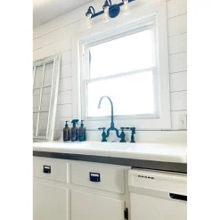 Kingston Brass Tudor Bridge Deck Mount Kitchen Faucet with Brass Sprayer