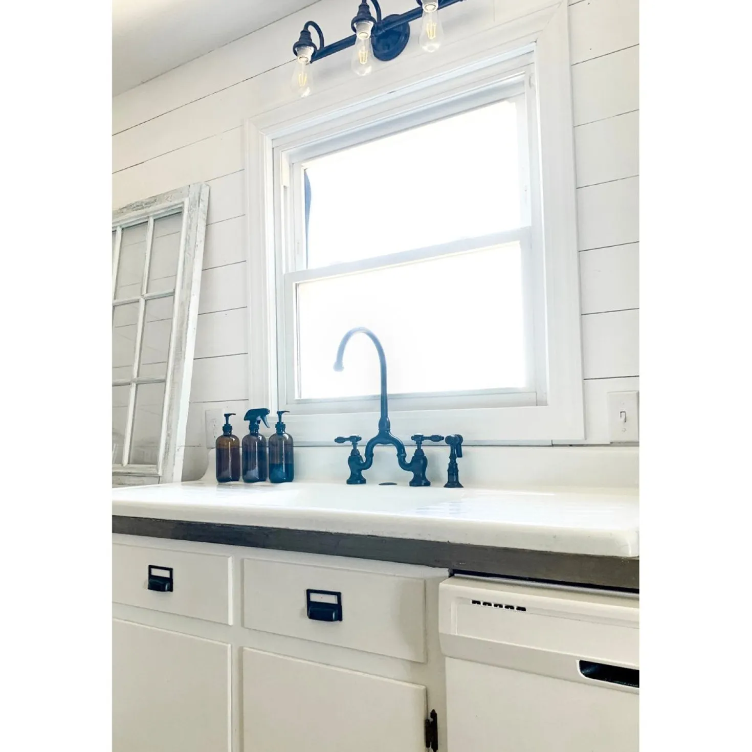 Kingston Brass Tudor Bridge Deck Mount Kitchen Faucet with Brass Sprayer