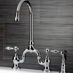 Kingston Brass Tudor Bridge Deck Mount Kitchen Faucet with Brass Sprayer