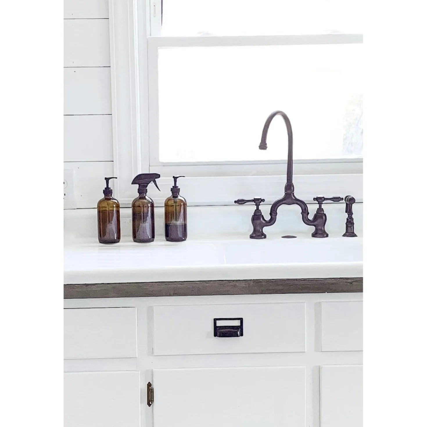 Kingston Brass Tudor Bridge Deck Mount Kitchen Faucet with Brass Sprayer