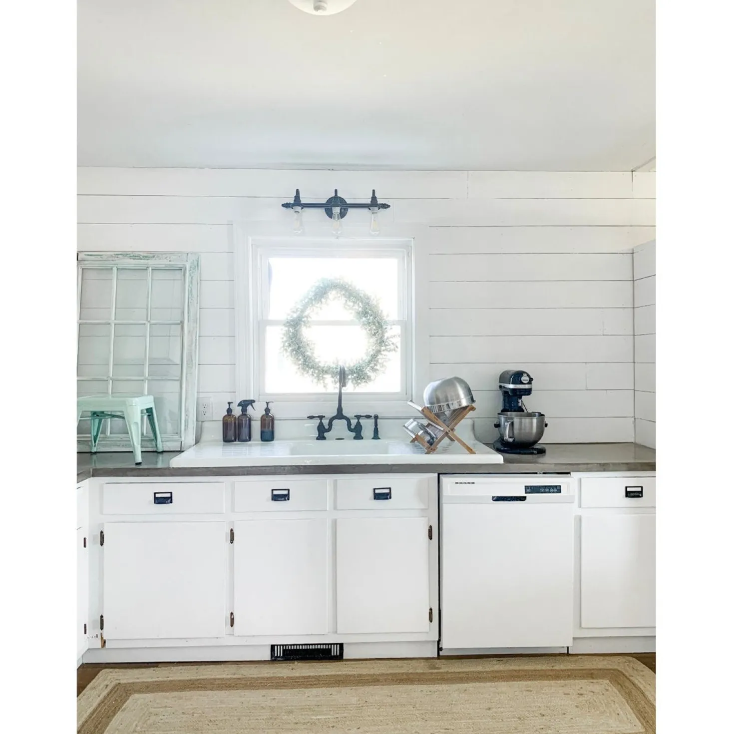 Kingston Brass Tudor Bridge Deck Mount Kitchen Faucet with Brass Sprayer