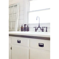 Kingston Brass Tudor Bridge Deck Mount Kitchen Faucet with Brass Sprayer