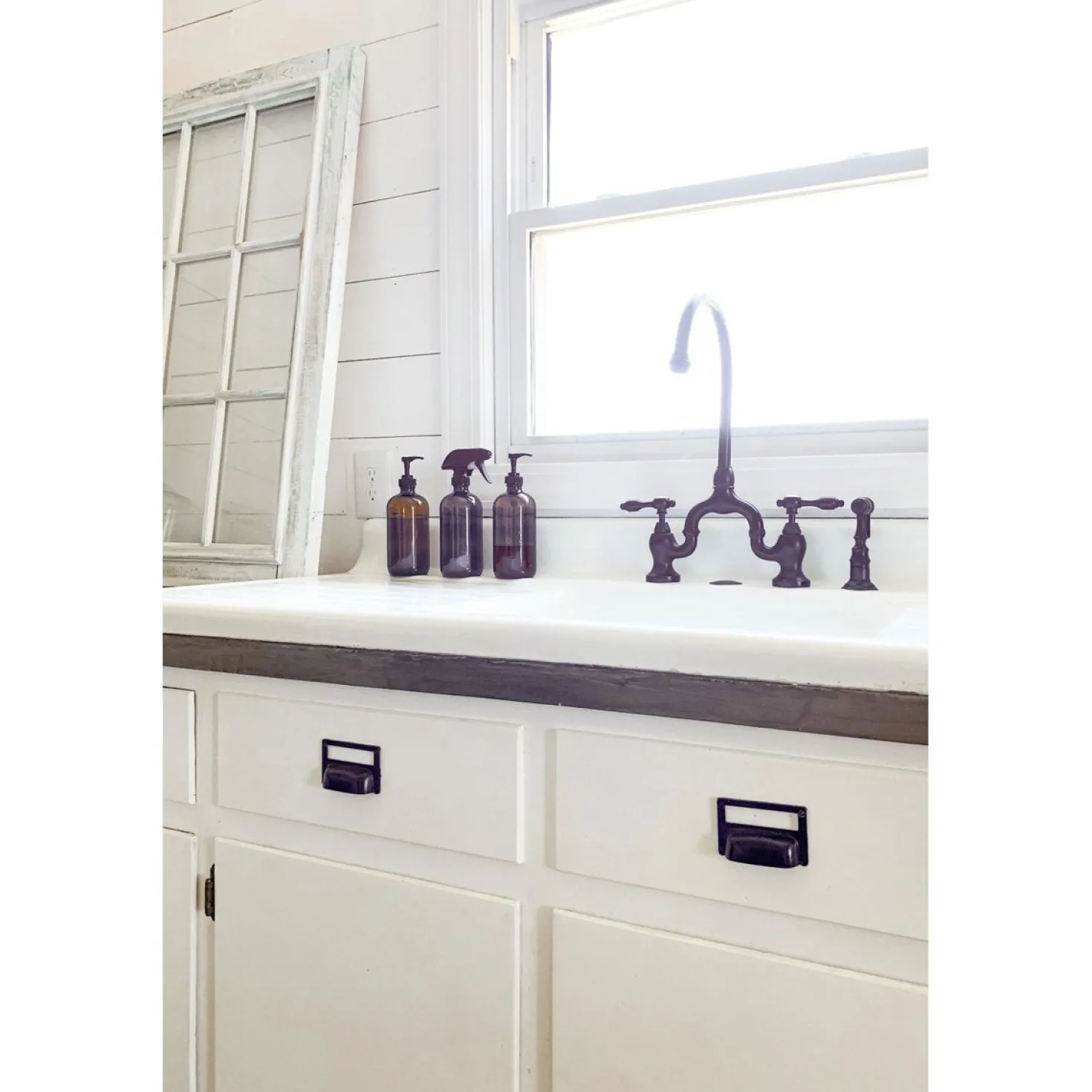 Kingston Brass Tudor Bridge Deck Mount Kitchen Faucet with Brass Sprayer