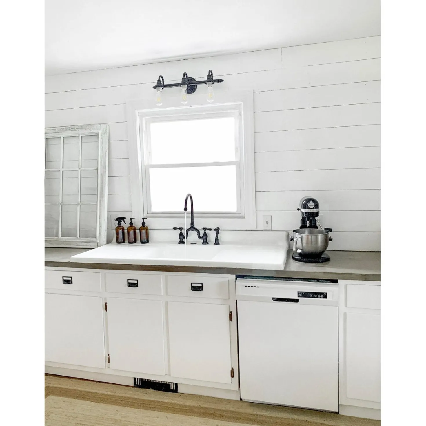 Kingston Brass Tudor Bridge Deck Mount Kitchen Faucet with Brass Sprayer