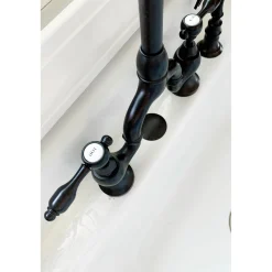 Kingston Brass Tudor Bridge Deck Mount Kitchen Faucet with Brass Sprayer