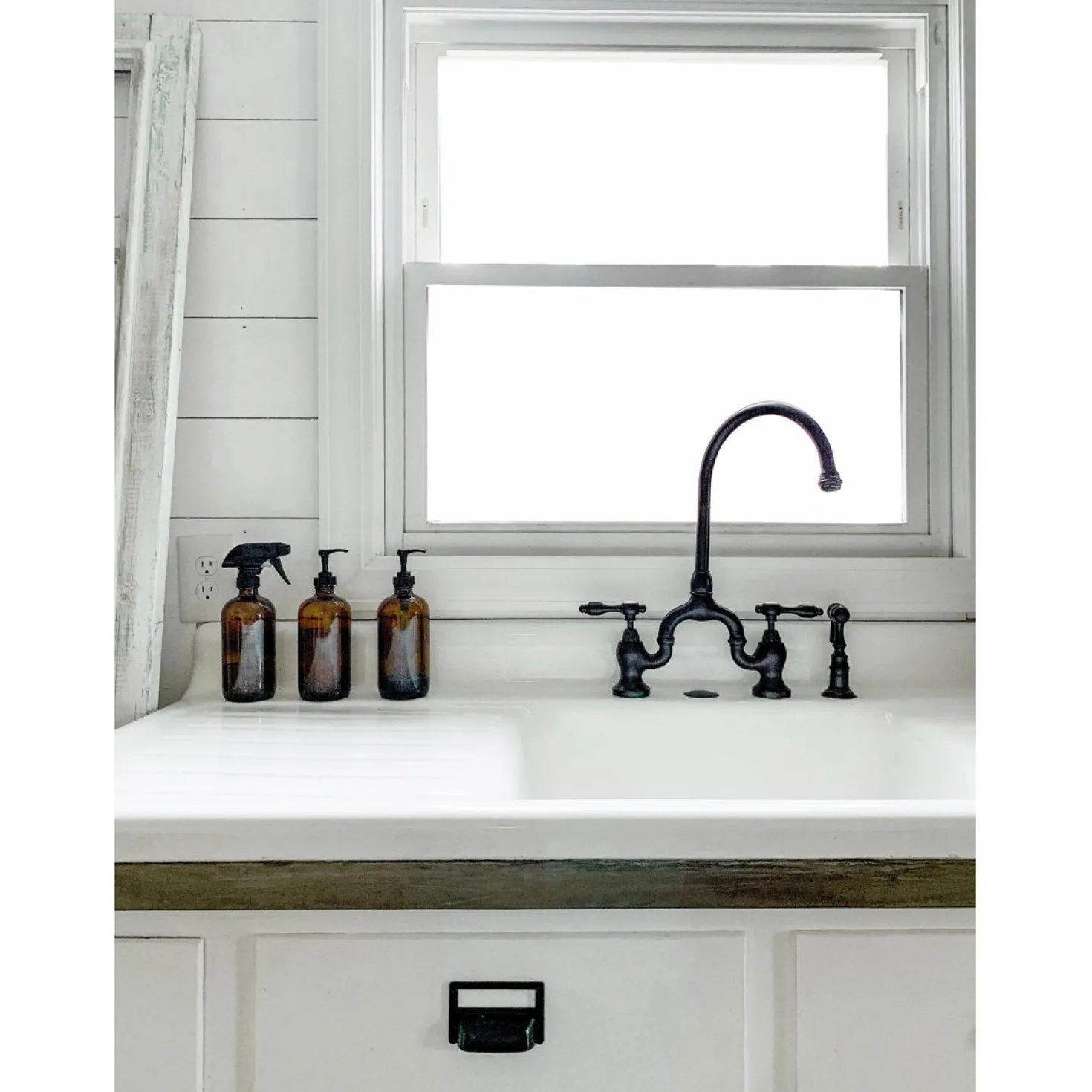 Kingston Brass Tudor Bridge Deck Mount Kitchen Faucet with Brass Sprayer