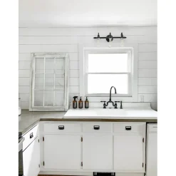 Kingston Brass Tudor Bridge Deck Mount Kitchen Faucet with Brass Sprayer