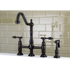 Kingston Brass Tudor Bridge Kitchen Faucet with Brass Sprayer