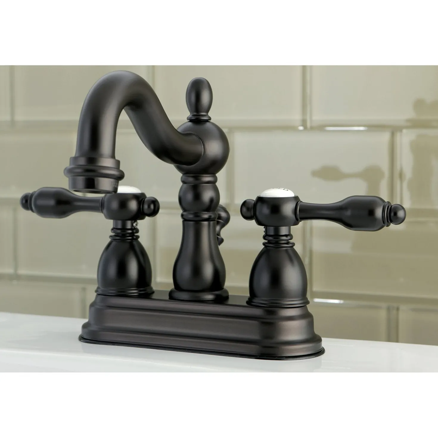 Kingston Brass Tudor Classic 4" Center Lavatory Faucet with Brass Pop-up