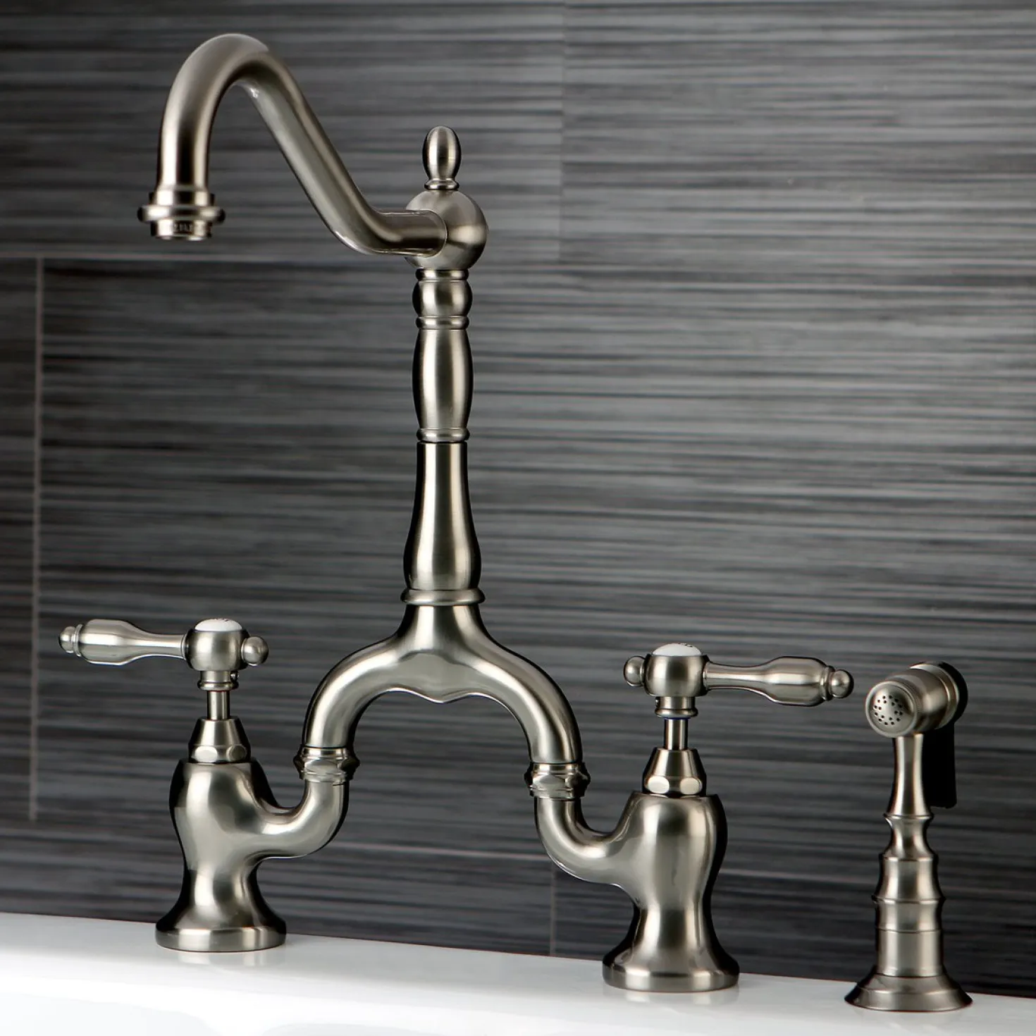Kingston Brass Tudor Deck Mount Bridge Kitchen Faucet with Brass Sprayer