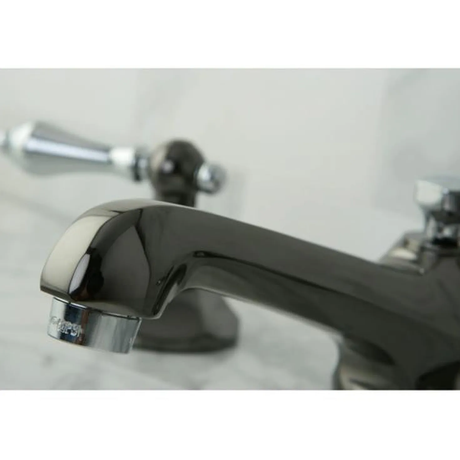 Kingston Brass Water Onyx 8" to 16" Widespread Three Hole Lavatory Faucet with Brass Pop-up Drain