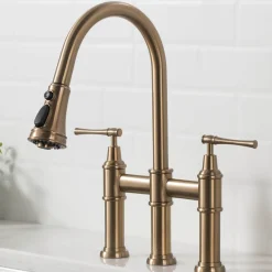 KRAUS Allyn Bridge Faucet with Pull-Down Sprayhead in Brushed Gold