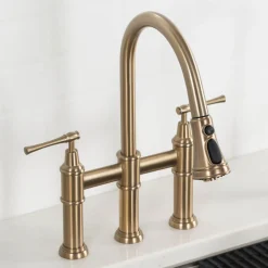 KRAUS Allyn Bridge Faucet with Pull-Down Sprayhead in Brushed Gold