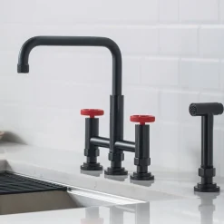 KRAUS Urbix Bridge Kitchen Faucet with Side Sprayer in Matte Black/Red